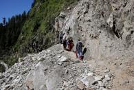 The Wider Image: Doctors scale rockslides, invoke gods to vaccinate Himalayan villages