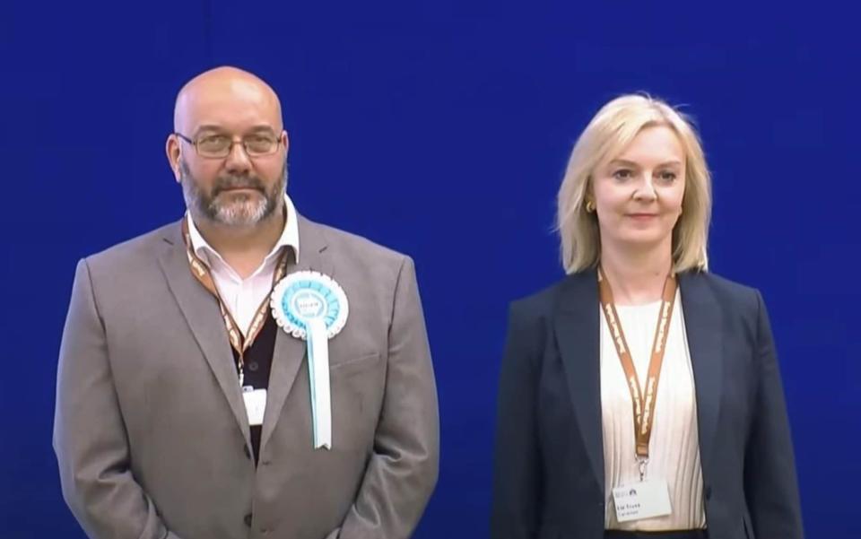 An awkward Liz Truss on stage in Norfolk