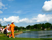 CHARLOTTE, NC - MAY 06: Rickie Fowler (R) of the United States and caddie Joseph Skovron (L) walk to the 17th green during the final round of the Wells Fargo Championship at the Quail Hollow Club on May 6, 2012 in Charlotte, North Carolina. (Photo by Mike Ehrmann/Getty Images)