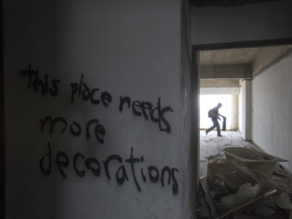 Graffiti on the walls of the abandoned Sathorn Unique tower in Bangkok, Thailand