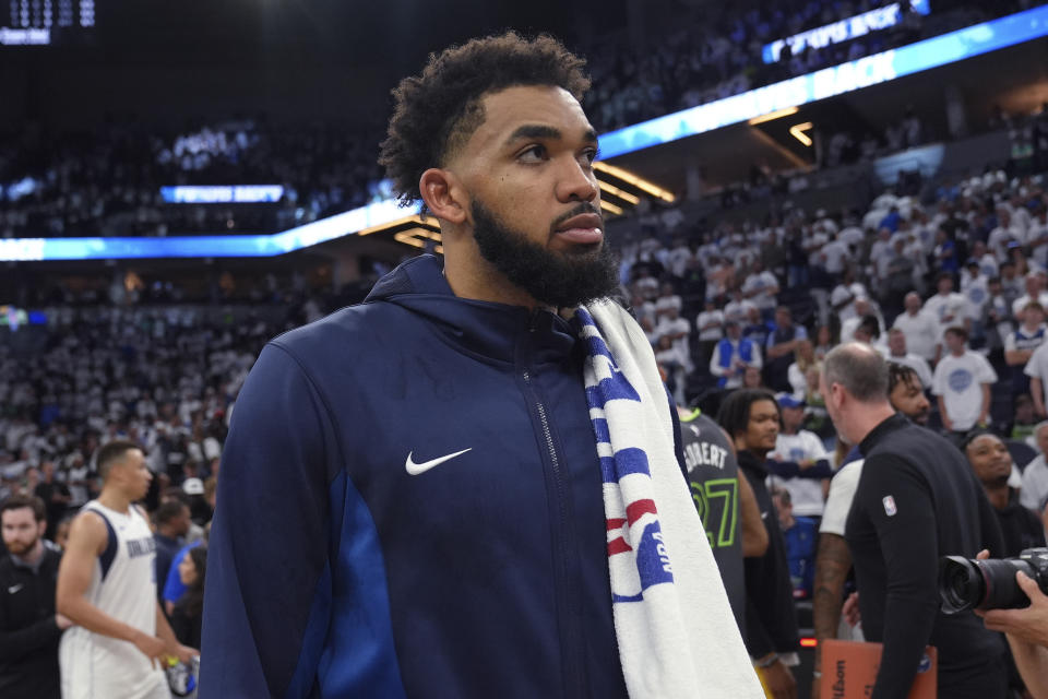 Minnesota Timberwolves center Karl-Anthony Towns walks off the court after Game 5 of the team's NBA basketball Western Conference finals against the Dallas Mavericks, Thursday, May 30, 2024, in Minneapolis. Dallas won 124-103, advancing to the NBA Finals. (AP Photo/Abbie Parr)