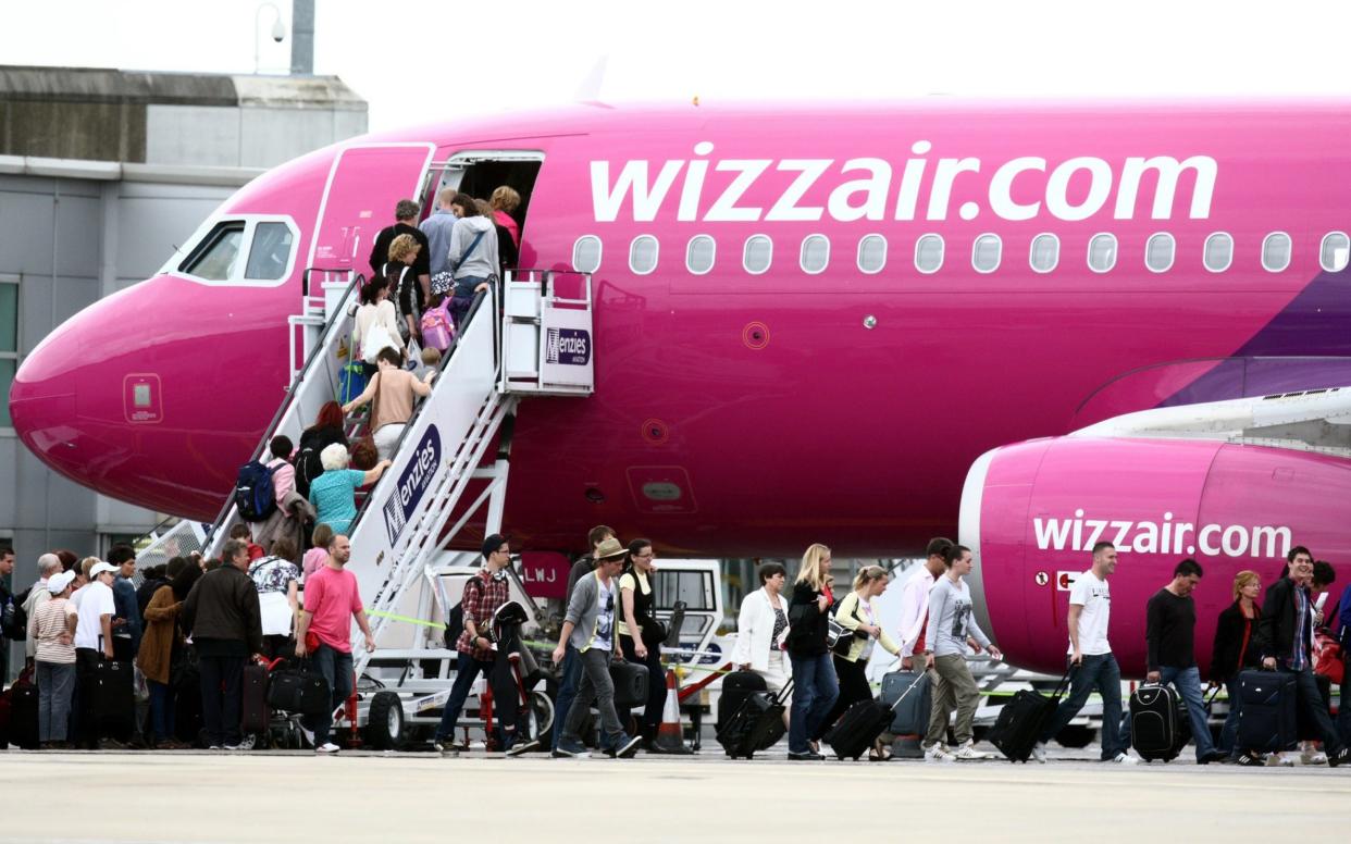 Passengers getting on a Wizz Air plane