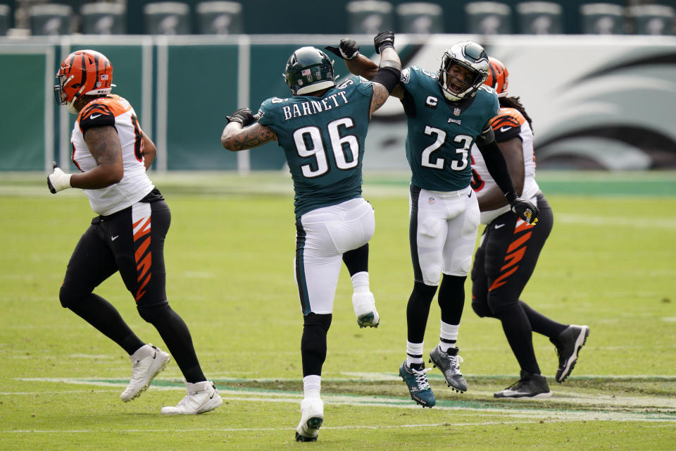 Philadelphia Eagles' Derek Barnett (96) and Rodney McLeod (23) celebrate after a sack by Barnett during the first half of an NFL football game against the Cincinnati Bengals, Sunday, Sept. 27, 2020, in Philadelphia. (AP Photo/Chris Szagola)