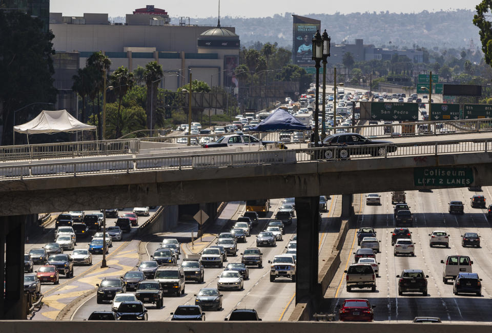 Los Angeles Police officers patrol the ramps over the traffic on the Harbor Freeway for the visit of President Donald Trump in Los Angeles Tuesday, Sept. 17, 2019. Trump began a California visit on Tuesday, saying he will do "something" about homelessness but offering no specifics beyond the mention of creating a task force. (AP Photo/Damian Dovarganes)