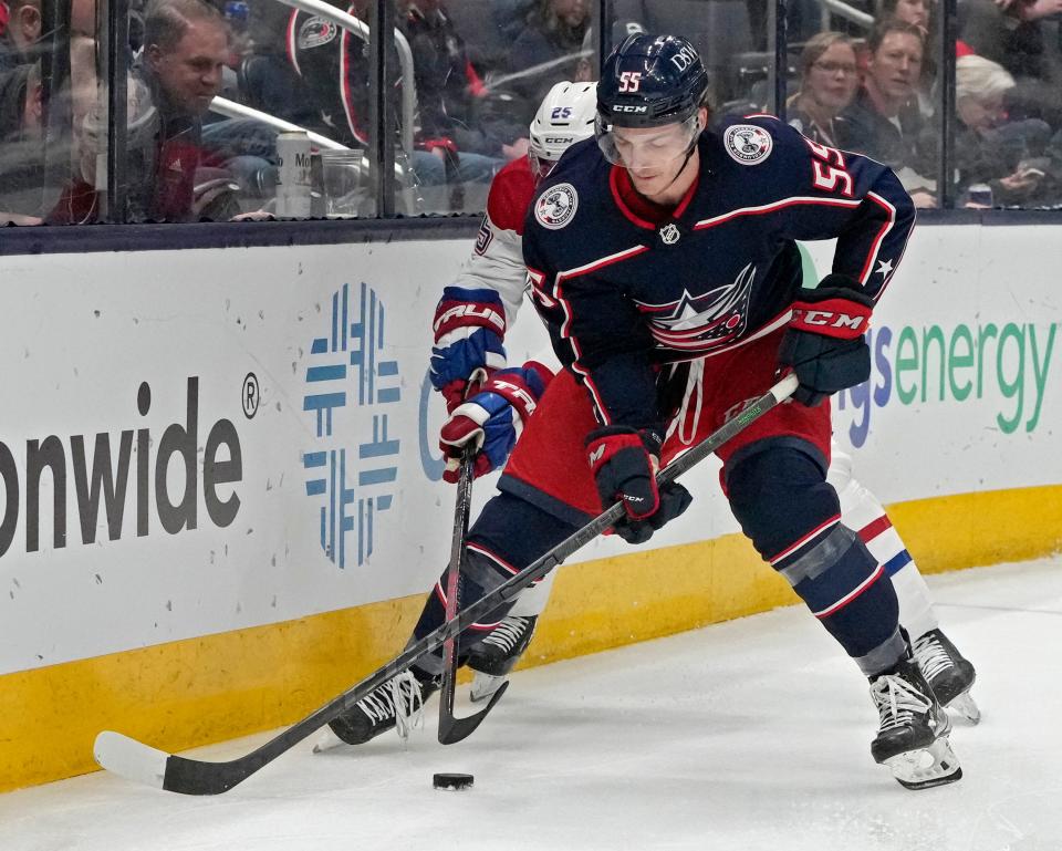 Apr 13, 2022; Columbus, Ohio, USA; Columbus Blue Jackets right wing Carson Meyer (55) is defended by Montreal Canadiens center Ryan Poehling (25) during Wednesday's NHL game at Nationwide Arena. Mandatory Credit: Barbara Perenic/Columbus Dispatch