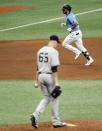 New York Yankees starter James Paxton (65) walks the mound after giving up a solo home run to Tampa Bay Rays' Brandon Loew, top, during the seventh inning of a baseball game Sunday, Aug. 9, 2020, in St. Petersburg, Fla. (AP Photo/Steve Nesius)