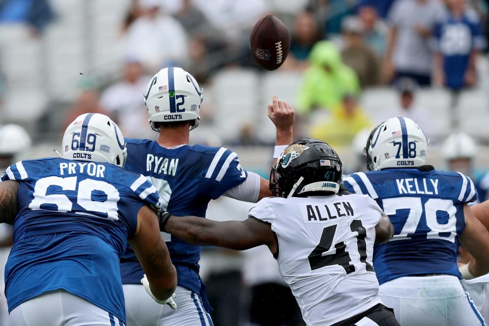 JACKSONVILLE, FLORIDA - SEPTEMBER 18: Josh Allen #41 of the Jacksonville Jaguars forces a fumble against Matt Ryan #2 of the Indianapolis Colts in the second quarter at TIAA Bank Field on September 18, 2022 in Jacksonville, Florida.