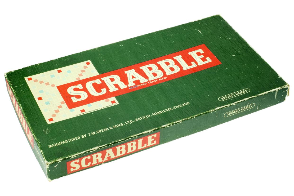 Vintage Scrabble board game box on a white background