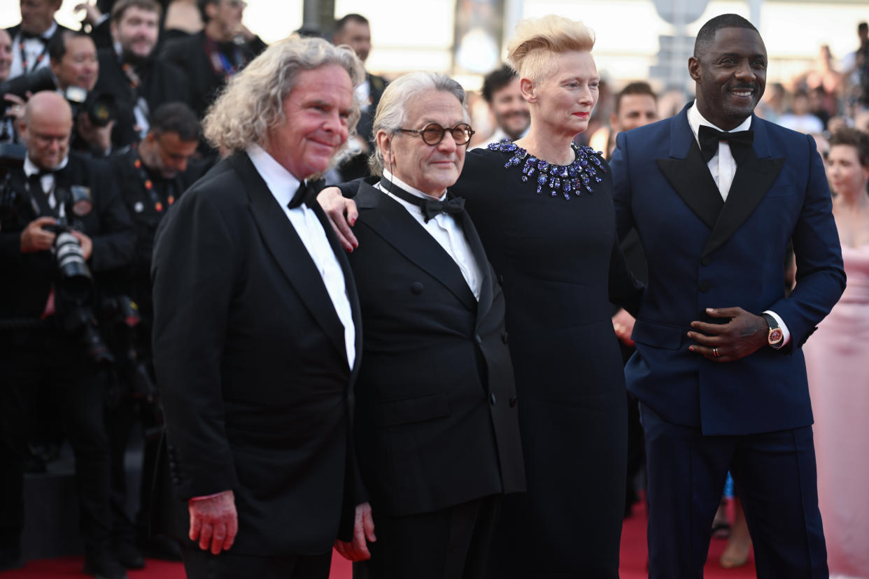 British producer Doug Mitchell, Australian director and screenwriter George Miller, British actress Tilda Swinton and Brisith actor Idris Elba arrive for the screening of the film 