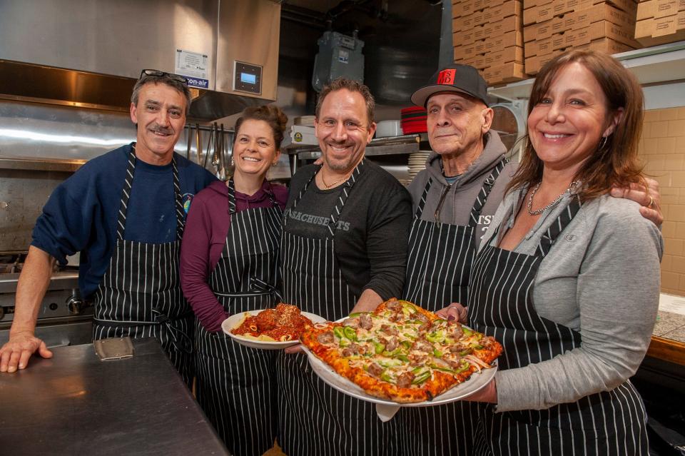 Bronzetti's Pizza and Kitchen is now offering food out of the South Framingham Fraternal Order of Eagles kitchen. From left are Manny Lage, Melissa Hanna, Bubba Bronzetti, Bill Phillips and Sharon Bronzetti.