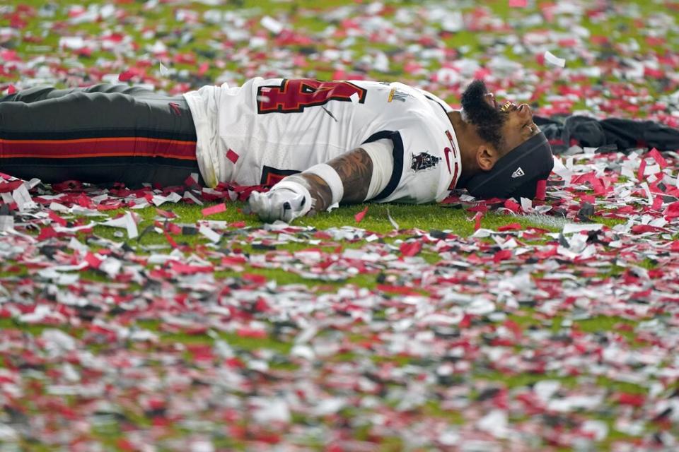 Tampa Bay Buccaneers cornerback Carlton Davis celebrates on the field after their NFL Super Bowl 55 football game against the Kansas City Chiefs, Sunday, Feb. 7, 2021, in Tampa, Fla. The Buccaneers defeated the Chiefs 31-9 to win the Super Bowl. (AP Photo/Gregory Bull)