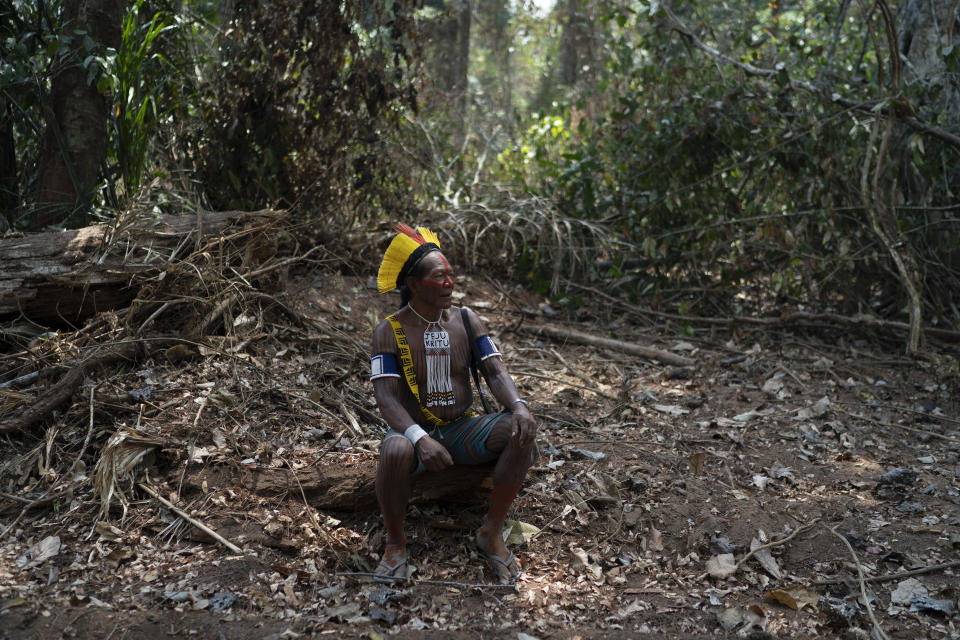 Krimej village indigenous Chief Kadjyre Kayapo, of the Kayapo indigenous community, pauses on the path opened by illegal loggers on the border between Menkragnotire indigenous lands and the Biological Reserve Serra do Cachimbo in Altamira, Para state, Brazil, Saturday, Aug. 31, 2019. Much of the deforestation in the Brazilian Amazon is done illegally -- land grabbers burn areas to clear land for agriculture and loggers encroach on national forests and indigenous reserves, and Kayapo says he does not want loggers and prospectors on his land. (AP Photo/Leo Correa)