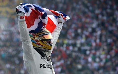 British driver Lewis Hamilton celebrates wining his fourth Formula One championship after the Mexican Formula One Grand Prix auto race at the Hermanos Rodriguez racetrack in Mexico City, Sunday, Oct. 29, 2017 - Credit: AP