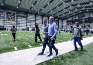 Sean Payton, center left, leaves with general manager Mickey Loomis following an NFL football press conference announcing his resignation as head coach of the New Orleans Saints, Tuesday, Jan. 25, 2022, in Metairie, La. (AP Photo/Derick Hingle)