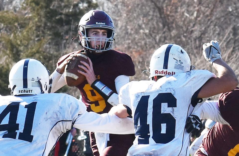 Case quarterback Jack Orton looks downfield for a receiver in the 2022 Thanksgiving Day game.