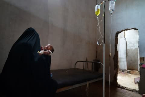 Patients receive limited treatment at a bombed-out doctors office in Dhubab, Yemen - Credit: Susan Schulman