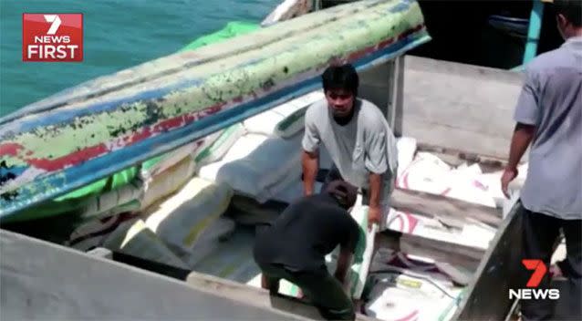 Authorities unloading the boat. Source: 7News