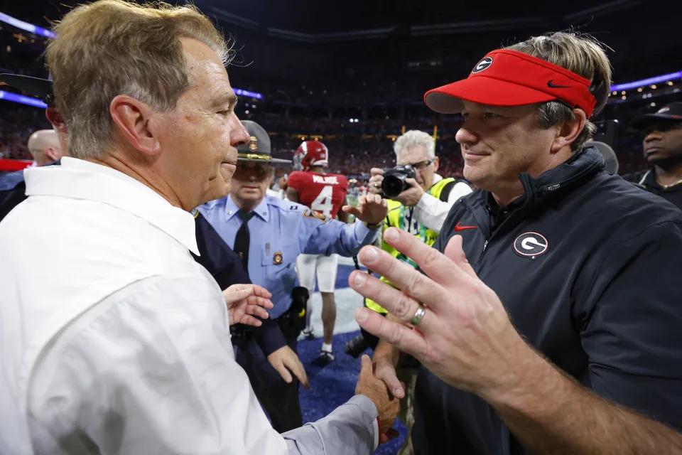  Head coach Nick Saban of the Alabama Crimson Tide shakes hands with Head coach Kirby Smart of the Georgia Bulldogs after defeating the Georgia Bulldogs 27-24 in the SEC Championship at Mercedes-Benz Stadium on December 2, 2023 in Atlanta, Georgia. (Photo by Todd Kirkland/Getty Images)