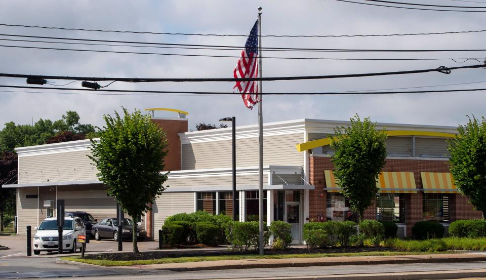 Drivers pick up their orders at the drive-thru at the McDonald's restaurant at 343 Cochituate Road in Framingham, July 14, 2022. Police are investigating after two teens were shot overnight at the eatery.