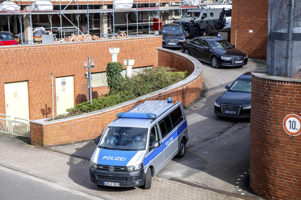 An armored police vehicle leaves the courtyard of the district court together with other vehicles, in Verden, Germany, Tuesday, Feb. 27, 2024. The former terrorist of the Red Army Faction (RAF), Daniela Klette (65), has been arrested in Berlin. (Sina Schuldt/dpa via AP)