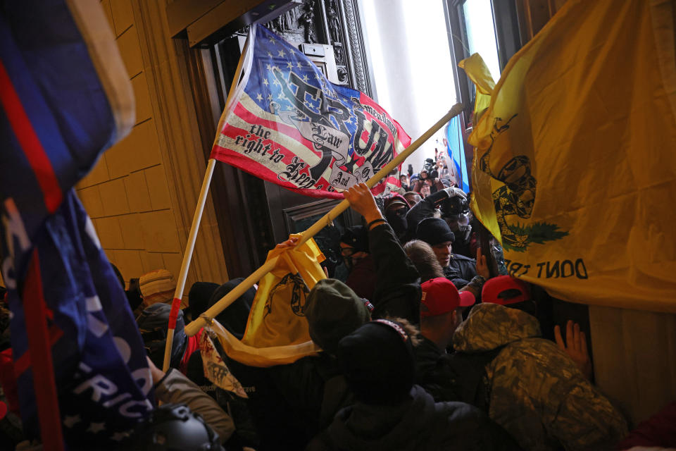 Rioters breaking into the Capitol