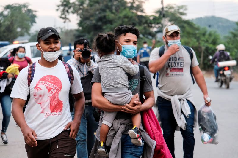 Hondurans take part in a new caravan of migrants, set to head to the United States, in San Pedro Sula