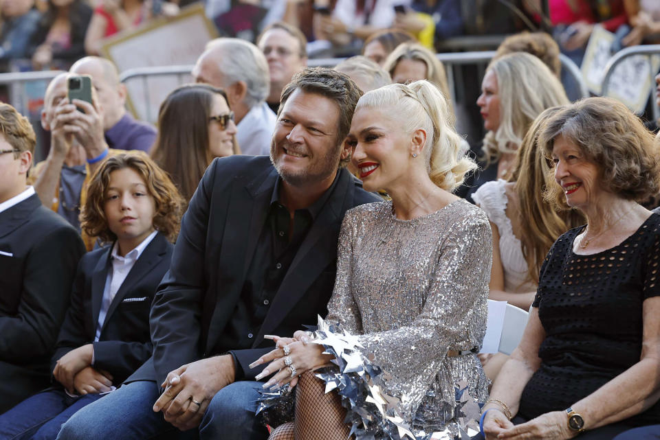 Blake Shelton sits near Gwen Stefani during her Hollywood Walk of Fame ceremony (Emma McIntyre / Getty Images)