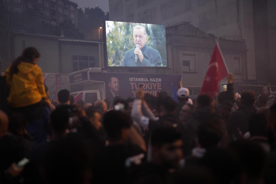 Supporters of the President Recep Tayyip Erdogan celebrate outside AK Party offices in Istanbul, Turkey, Sunday, May 28, 2023. Turkey's incumbent President Recep Tayyip Erdogan has declared victory in his country's runoff election, extending his rule into a third decade. (AP Photo/Khalil Hamra)