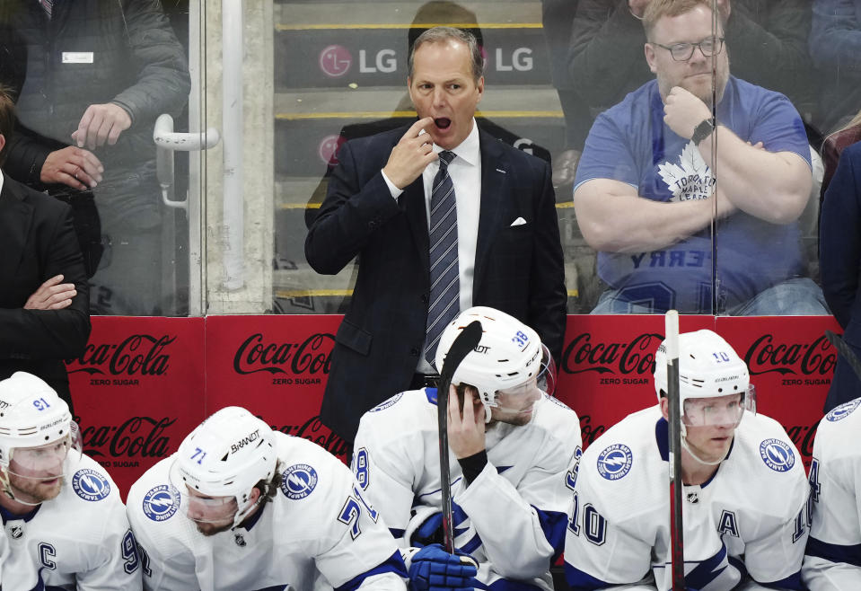 Tampa Bay Lightning coach Jon Cooper watches during the second period of Game 2 of the team's NHL hockey Stanley Cup first-round playoff series against the Toronto Maple Leafs on Thursday, April 20, 2023, in Toronto. (Nathan Denette/The Canadian Press via AP)