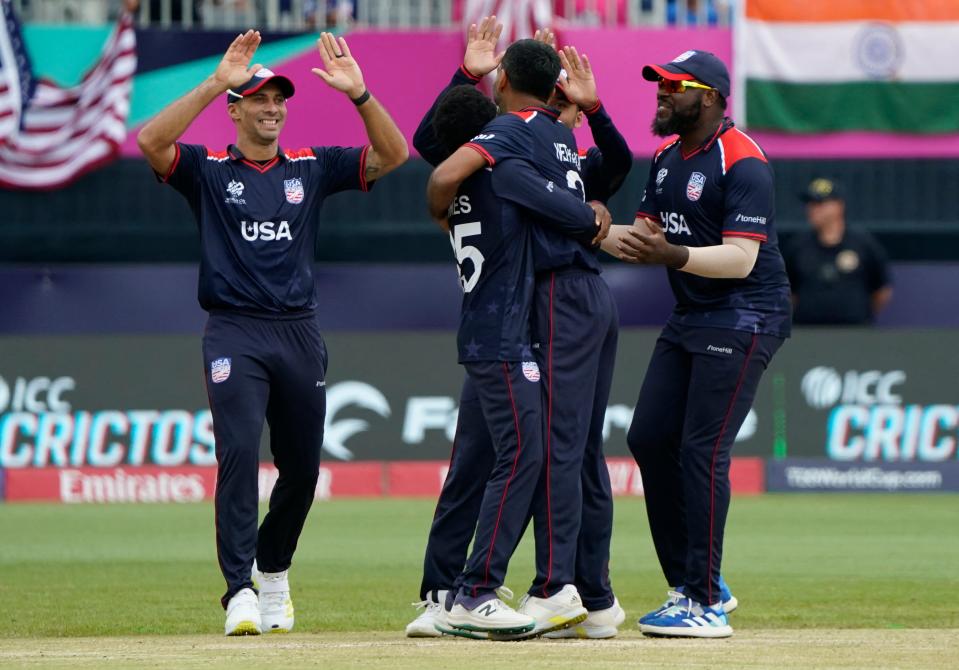 USA celebrates after India's captain Rohit Sharma was caught out during the ICC men's Twenty20 World Cup 2024 group A cricket match between the USA and India at Nassau County International Cricket Stadium in East Meadow, New York on June 12, 2024.