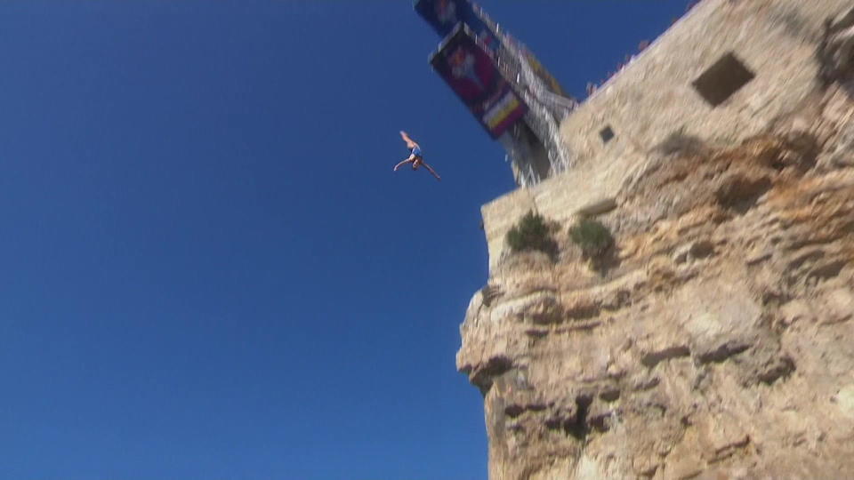 A participant in the Red Bull Cliff Diving World Series at Polignano a Mare, Italy.  / Credit: CBS News