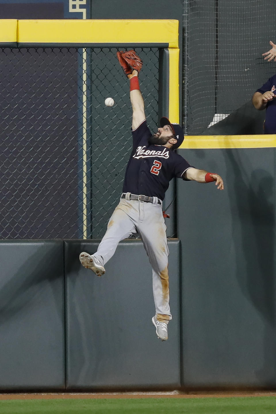 Washington Nationals right fielder Adam Eaton can't get a glove on a RBI-double by Houston Astros' George Springer during the eighth inning of Game 1 of the baseball World Series Tuesday, Oct. 22, 2019, in Houston. (AP Photo/Matt Slocum)