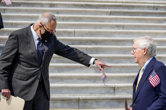 Image: Senate Majority Leader Chuck Schumer (D-NY) points at Senate Minority Leader Mitch McConnell as they arrive for a remembrance ceremony marking the 20th anniversary of the 9/11 terror attacks on the steps of the U.S. Capitol, on September 13, 2021 in Washington, DC. (Drew Angerer / Getty Images)