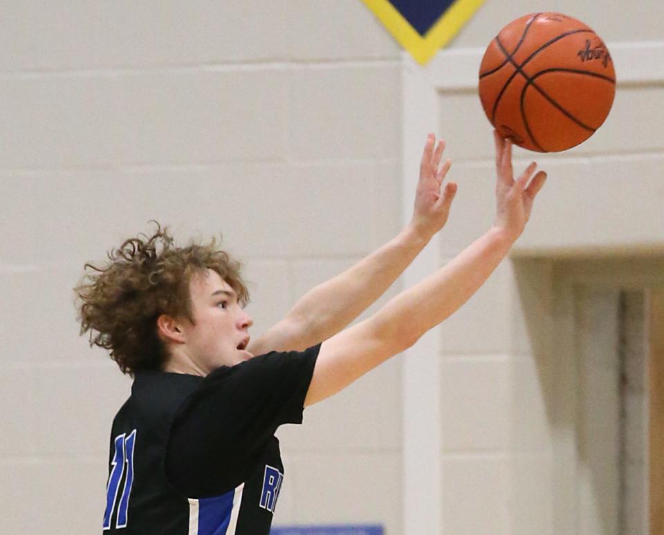 Revere's Conner Groce shoots a 3-pointer against East a 2023 OHSAA Division II district semifinal at North Ridgeville.