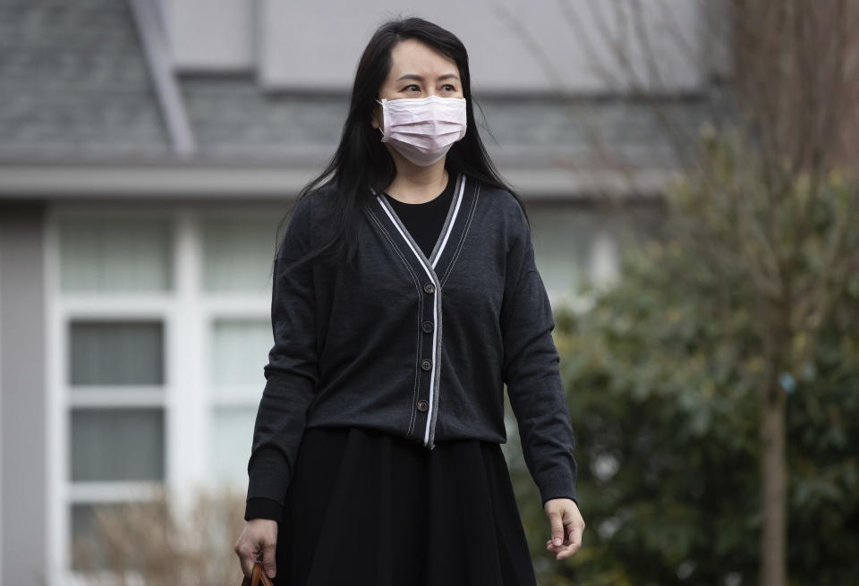 Meng Wanzhou, chief financial officer of Huawei, leaves her home to attend B.C. Supreme Court, in Vancouver, on Thursday, March 4, 2021. (Darryl Dyck/The Canadian Press via AP)