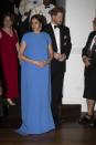 <p>The Duchess clearly loves a formal cape. She wore a blue version to a state dinner in Suva, Fiji. </p>