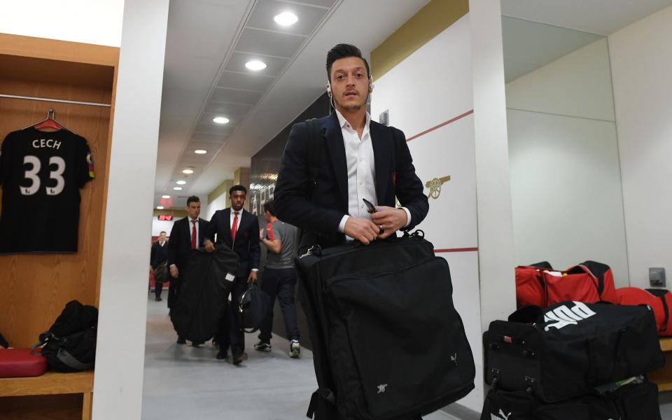 mesut Ozil in a suit - Credit: GETTY