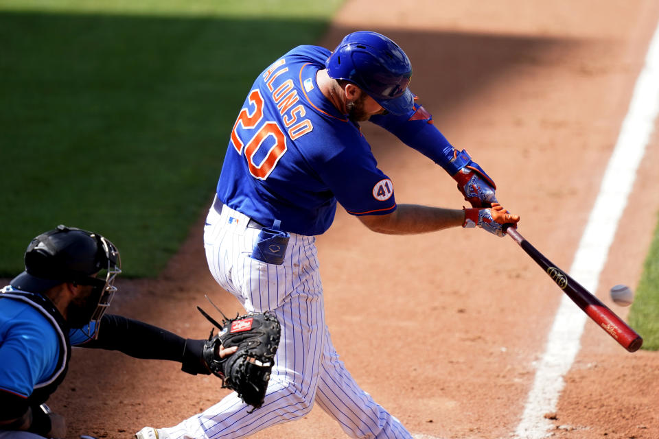 New York Mets' Pete Alonso (20) hits an RBI double to score Mallex Smith during the sixth inning of a spring training baseball game against the Miami Marlins, Friday, March 12, 2021, in Port St. Lucie, Fla. (AP Photo/Lynne Sladky)