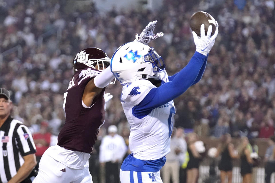 Kentucky running back Demie Sumo-Karngbaye (0) hauls in a 4-yard touchdown reception next Mississippi State safety Shawn Preston Jr. during the first half of an NCAA college football game in Starkville, Miss., Saturday, Nov. 4, 2023. (AP Photo/Rogelio V. Solis)