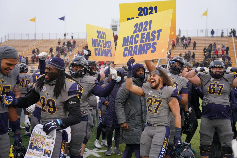 Kent State players celebrate a MAC East Division victory over Miami in overtime at Dix Stadium on Saturday, November 27, 2021.
