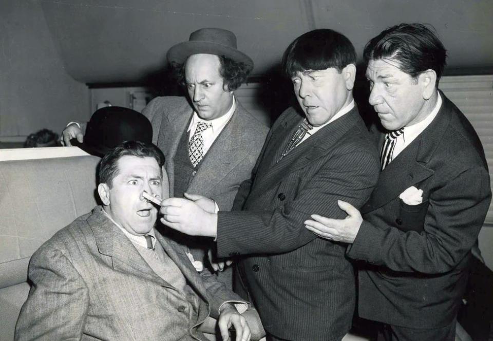 The Three Stooges - Larry, Moe and Shemp with Curly, seated - in the 1947 short "Hold that Lion." It's the only film all four appeared in.