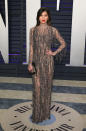 <p>Wearing a semi-sheer column dress. <em>[Photo: Getty]</em> </p>