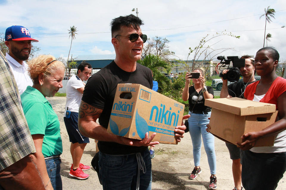 <p>The singer, who’s a native of Puerto Rico, helped deliver supplies to those devastated by Hurricane Maria. (Photo: Gladys Vega/Getty Images) </p>