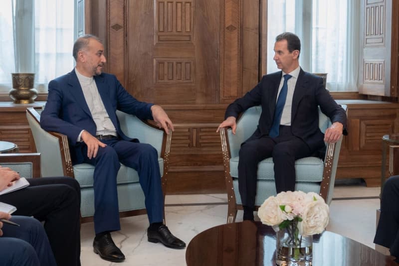 A photo released by the official Syrian Arab news agency (SANA) on 08 April 2024 shows Syrian President Bashar al-Assad meeting with Iranian Foreign Minister Hossein Amir-Abdollahian. -/SANA/dpa