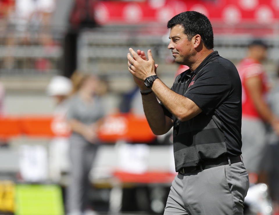 Ohio State acting head coach Ryan Day watches warmups before the start of an NCAA college football game against Oregon State Saturday, Sept. 1, 2018, in Columbus, Ohio. (AP Photo/Jay LaPrete)