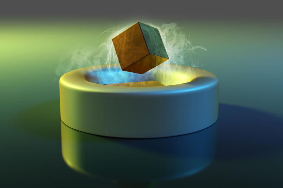 Illustration of magnetic levitation using a high-temperature ceramic superconductor. A magnetised cube is floating freely above a nitrogen-cooled slab of the superconducting ceramic. Discovered in 1986, the superconducting ceramics are expected to lead to a technological revolution and are the subject of intensive worldwide research. Superconductors lose all of their electrical resistance when cooled below a certain threshold temperature.