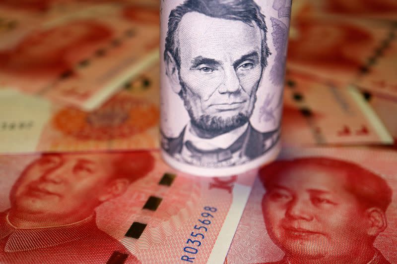 Illustration picture of U.S. Dollar and Chinese Yuan banknotes