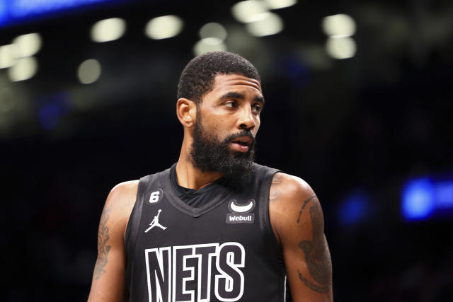 Brooklyn Nets guard Kyrie Irving, center left, and forward Kevin