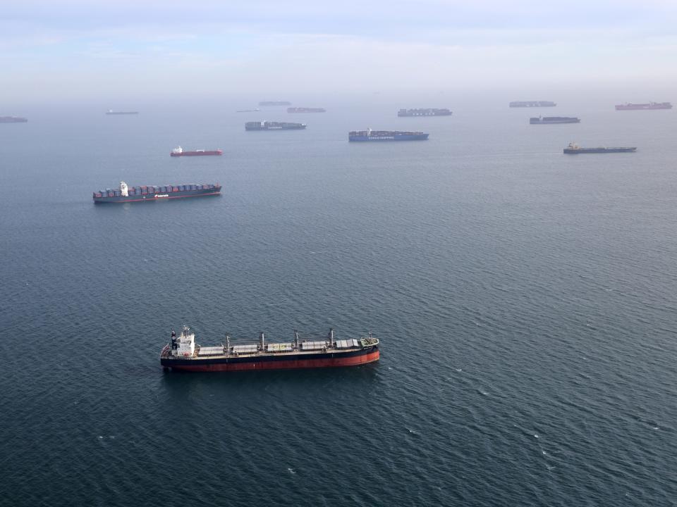 Ships wait outside US West Coast ports in April 2021.