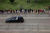 <p>The hearse carrying former first lady, Barbara Bush, drives past onlookers on George Bush Drive, followed by her husband, former U.S. President George H.W. Bush, son, former President George W. Bush, and their family to the George Bush Presidential Library and Museum for her burial in College Station, Texas, April 21, 2018. (Photo: Spencer Selvidge/Reuters) </p>